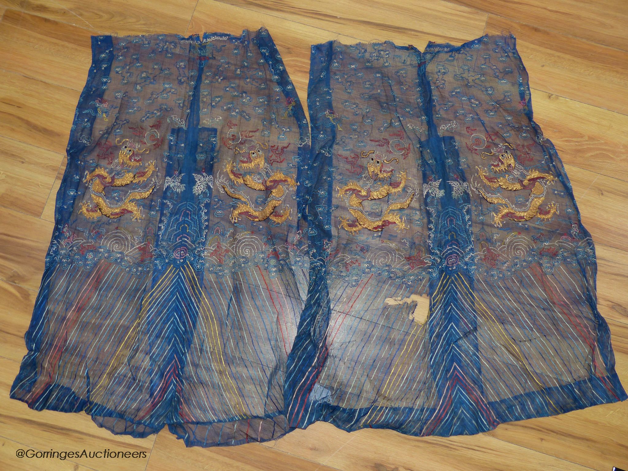 Two Chinese finely woven gauze panels with gold dragon embroidery, early 20th century